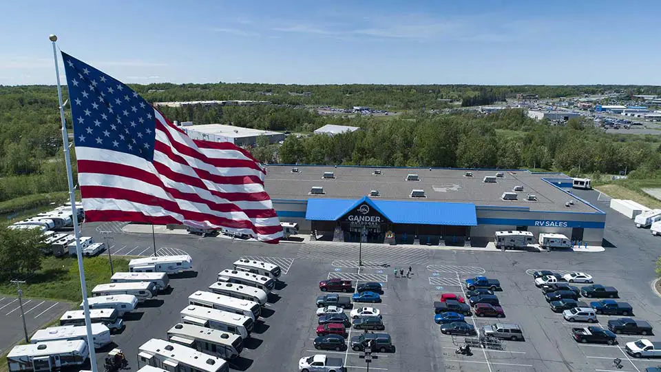drone photography - camper store with american flag flying high