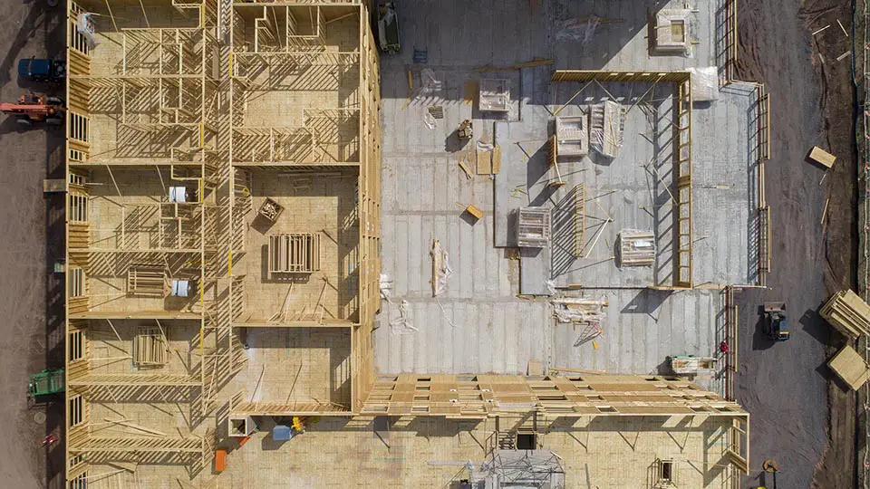 drone photo looking down on apartment building under construction