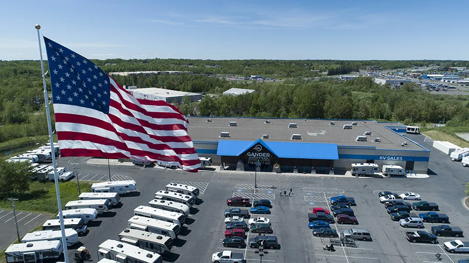 rv sales building behind american flag