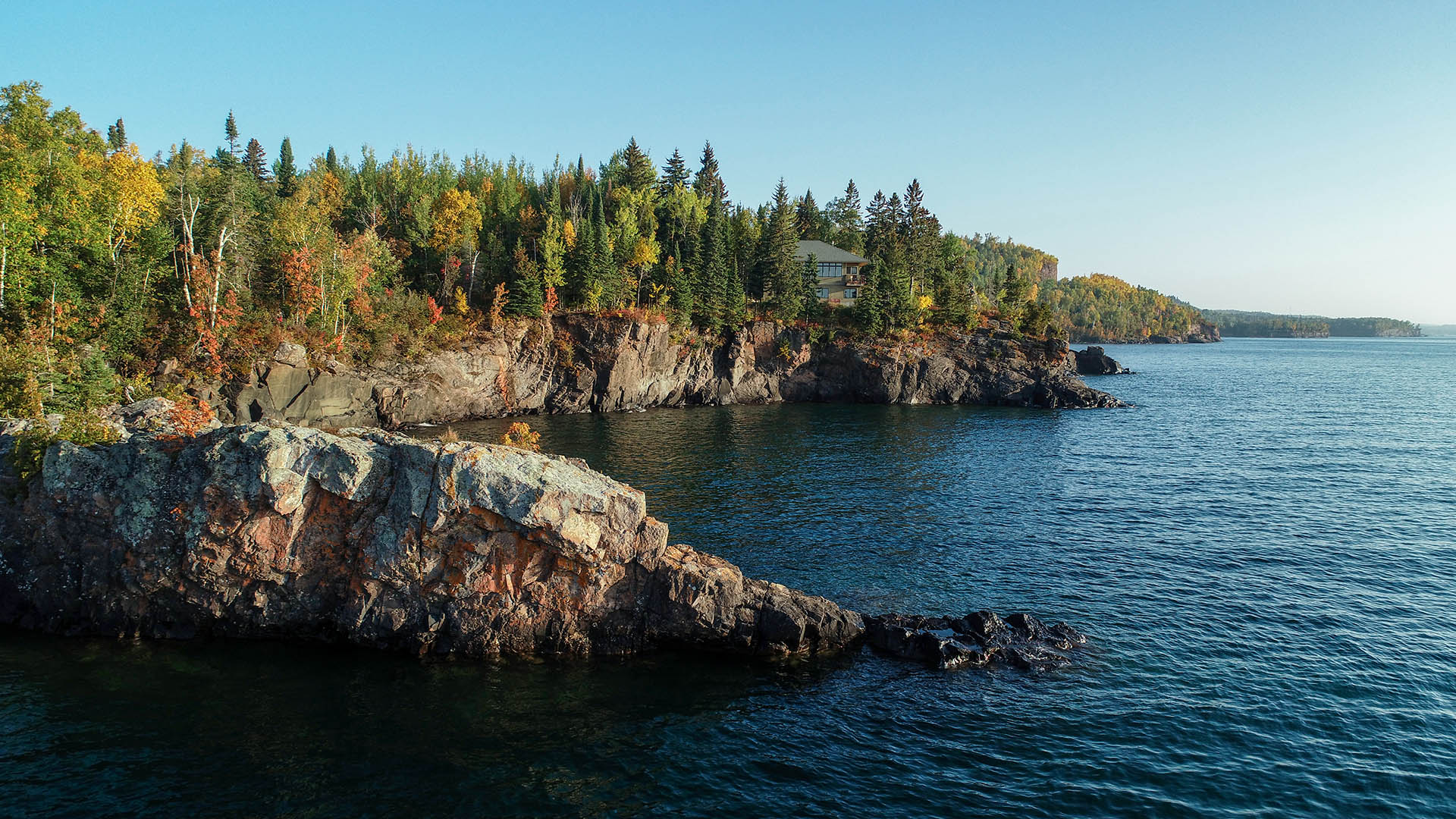 cliff side view of lake superior house